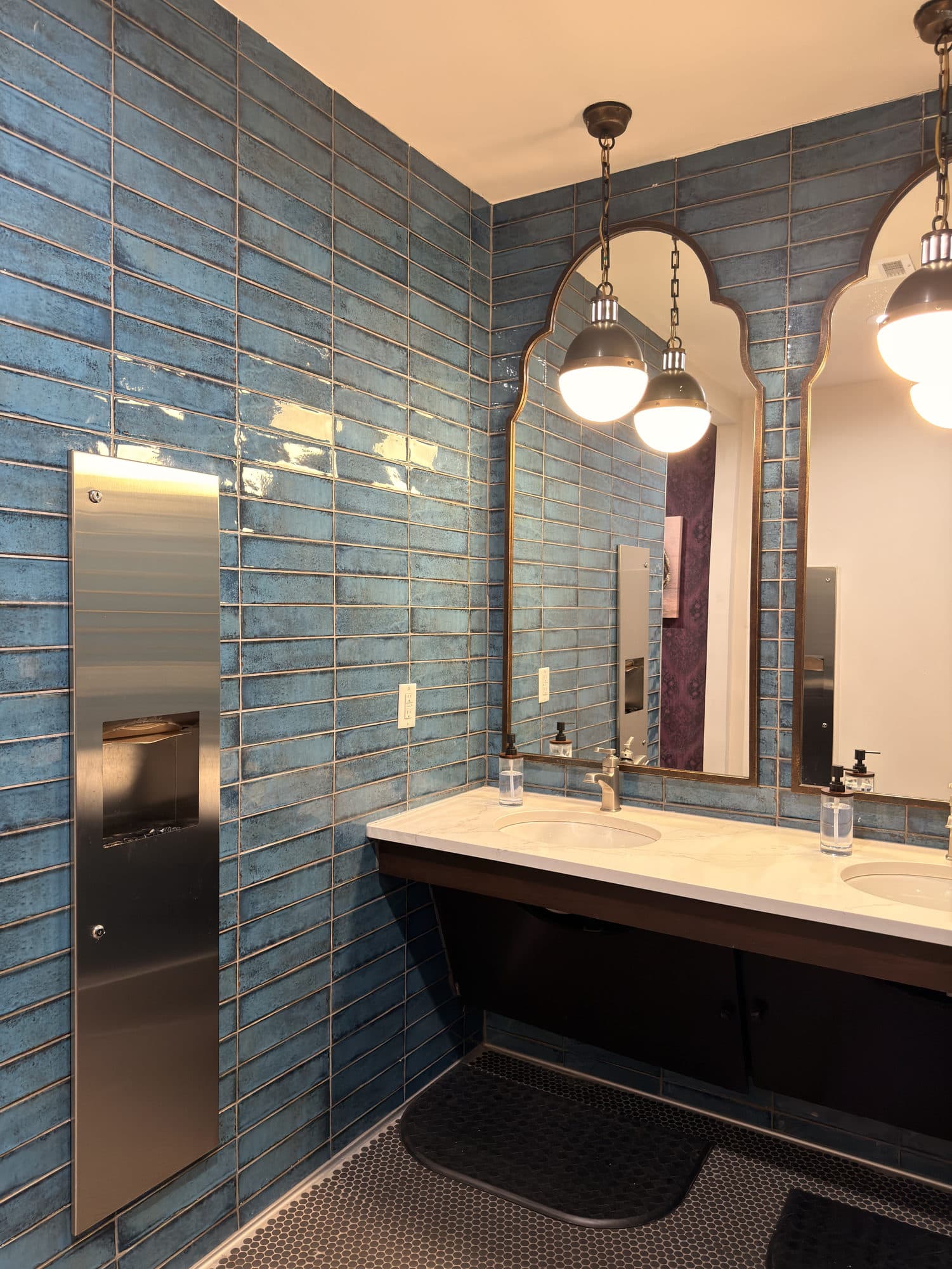 Tiled bathroom with pendant lighting