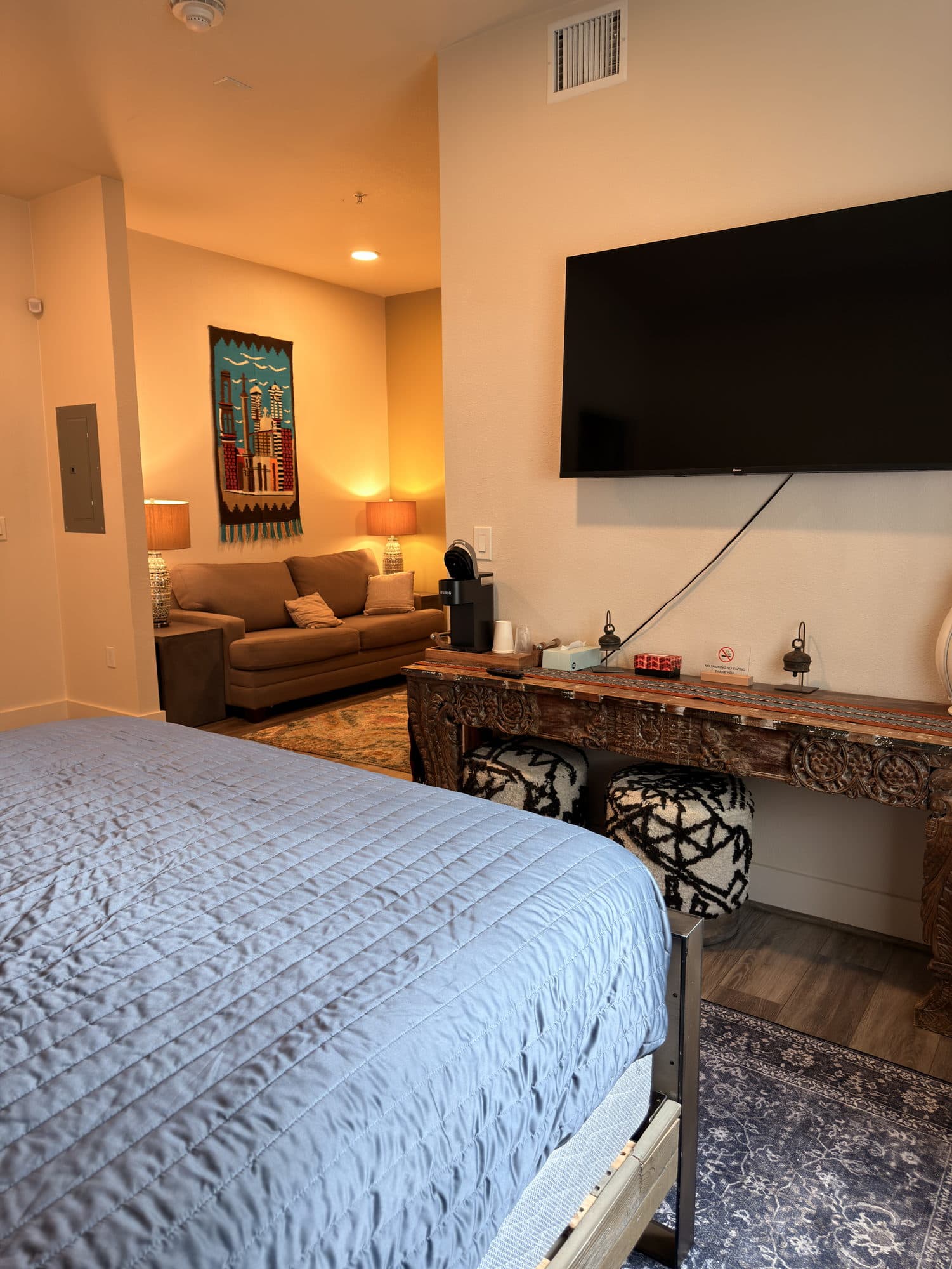 A warmly lit city-inspired guest room