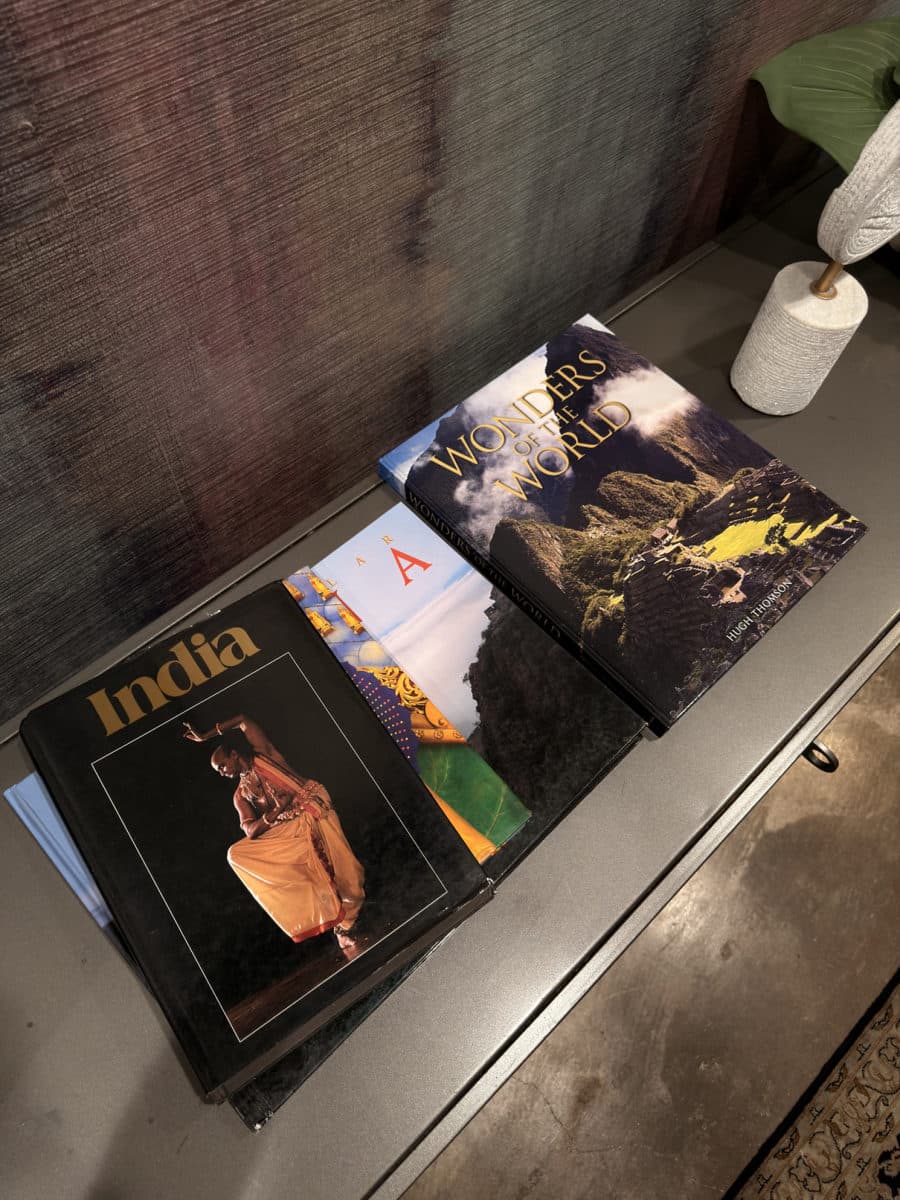 Curated travel books on a console table